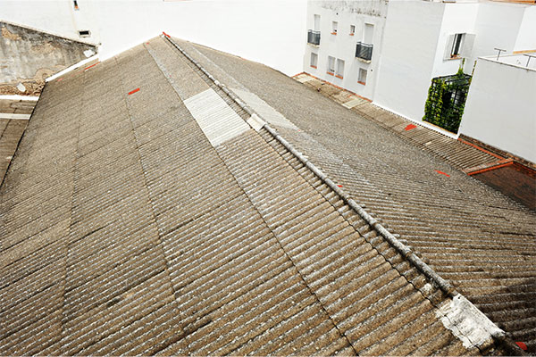 old asbestos cement roofing sheets on an industrial building