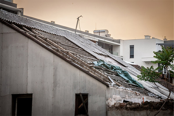 an old, damaged asbestos roof